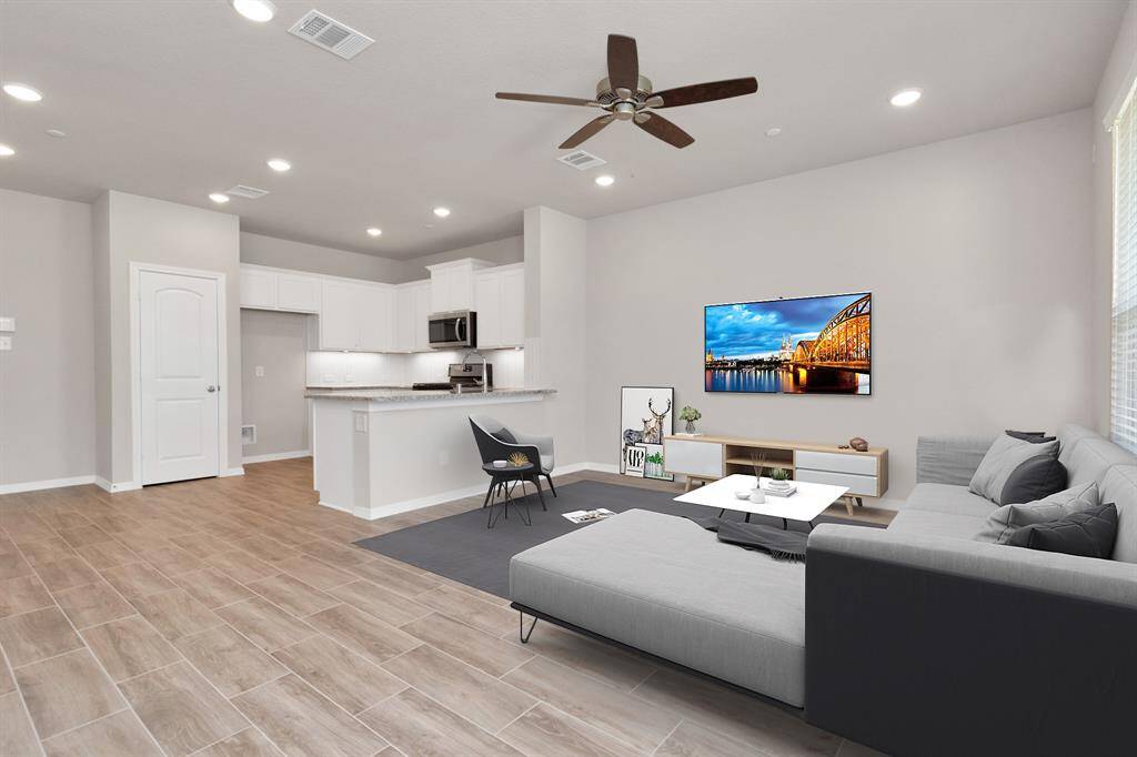 3 Bedrooms, 2.5 baths townhome with large front porch and 2 car garage available for immediate move-in. Virtually staged photo