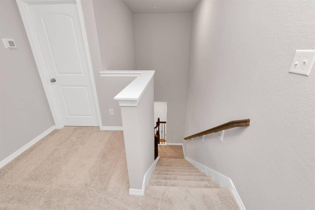 Upstairs are 3 bedrooms and 2 full baths.