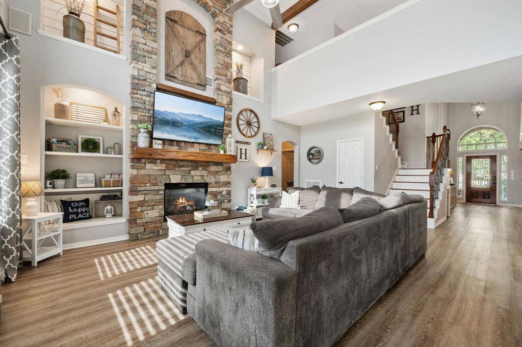 The tall ceiling and dramatic fireplace wall make this room so cozy!