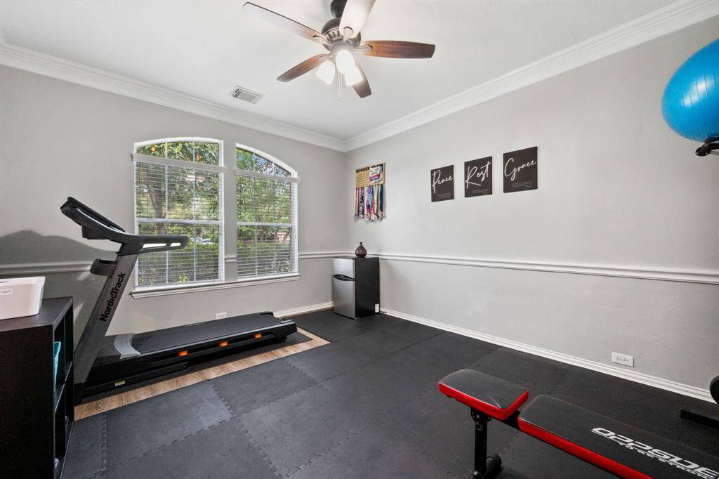 First floor work out room! Sliding barn doors keep it private from the entry hallway.