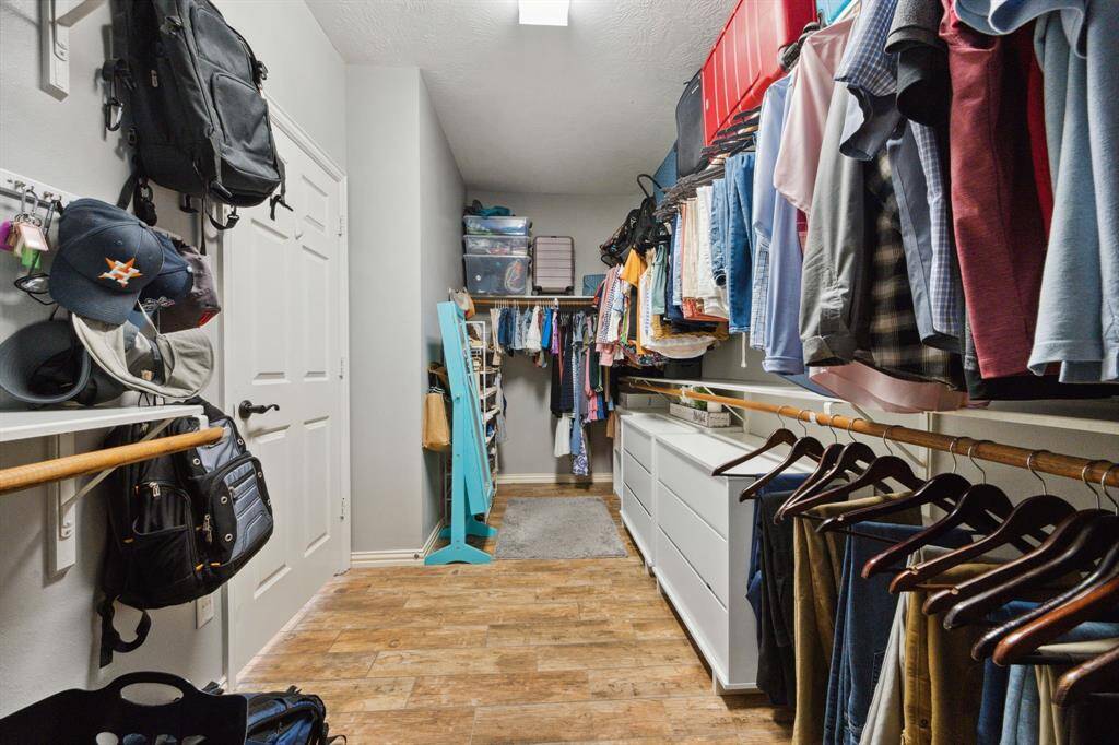 Primary closet is very spacious.