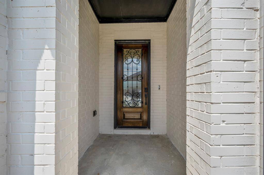 Approaching the front door you find a spacious front porch to welcome guests! It's finished with a 8ft Mahogany front door, smart door bell, and keyless entry.