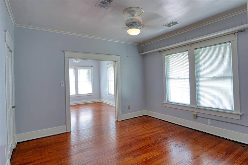 2nd bedroom. Doorway past the windows leads to the extra large study.