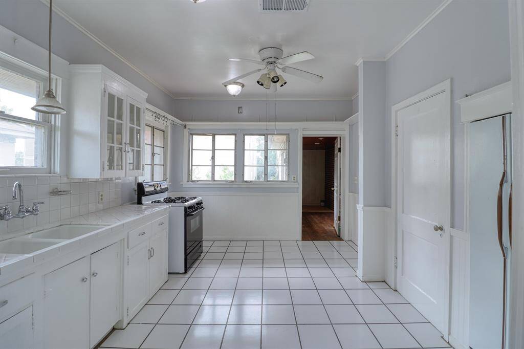 Extral large kitchen has room for an eat in table or portable island.