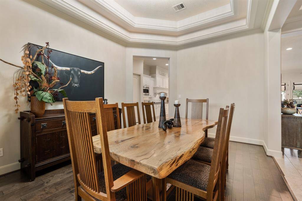 The Dining Room is large enough to accommodate a 12-person table in addition to other pieces like a buffet or drink cart. The opening straight ahead provides direct access to the Kitchen and Game Room. No need to stop the conversation when going back for second helpings.