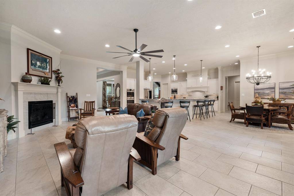 Notice how the Family Room flows effortlessly to the Kitchen and Breakfast Room, creating one large, open space that is also perfect for continued conversation with the family chef. This open concept design is ideal for entertaining.