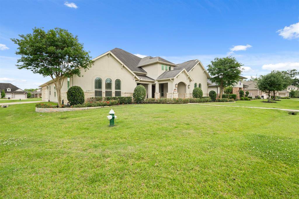 This impressive home sits on a double lot that totals .67 acres. Located on a corner of a quiet side street, behind 24-hour manned gates, this home provides an added sense of peace and security.