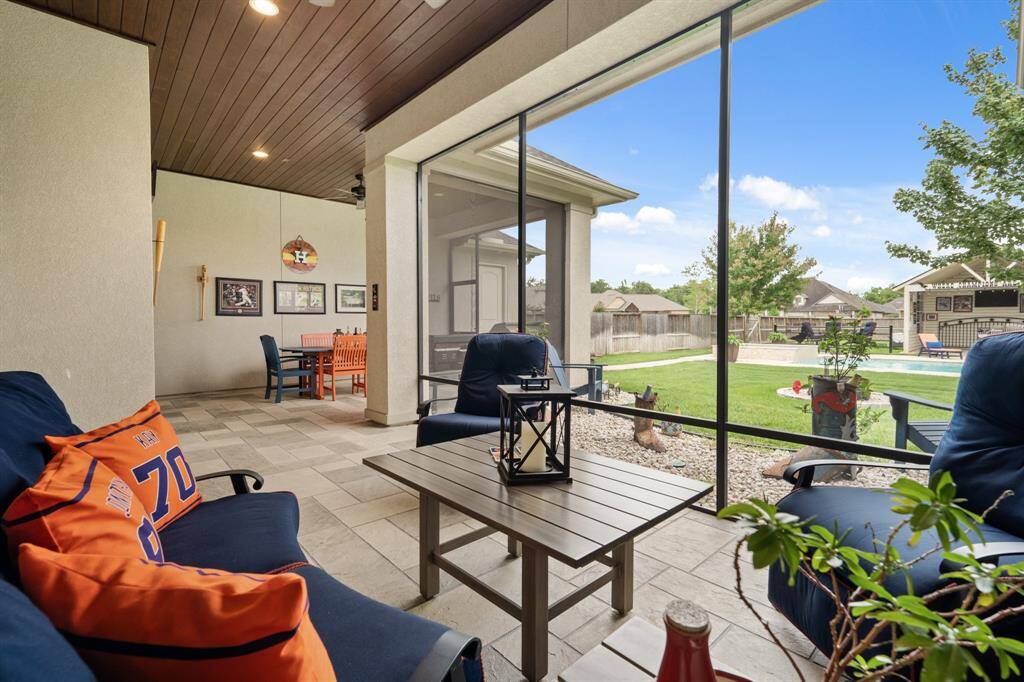Enjoy this view bug free and safe from the elements year-round thanks to the floor-to-ceiling screens. This Porch is so large it can offer up outdoor seating and dining options.