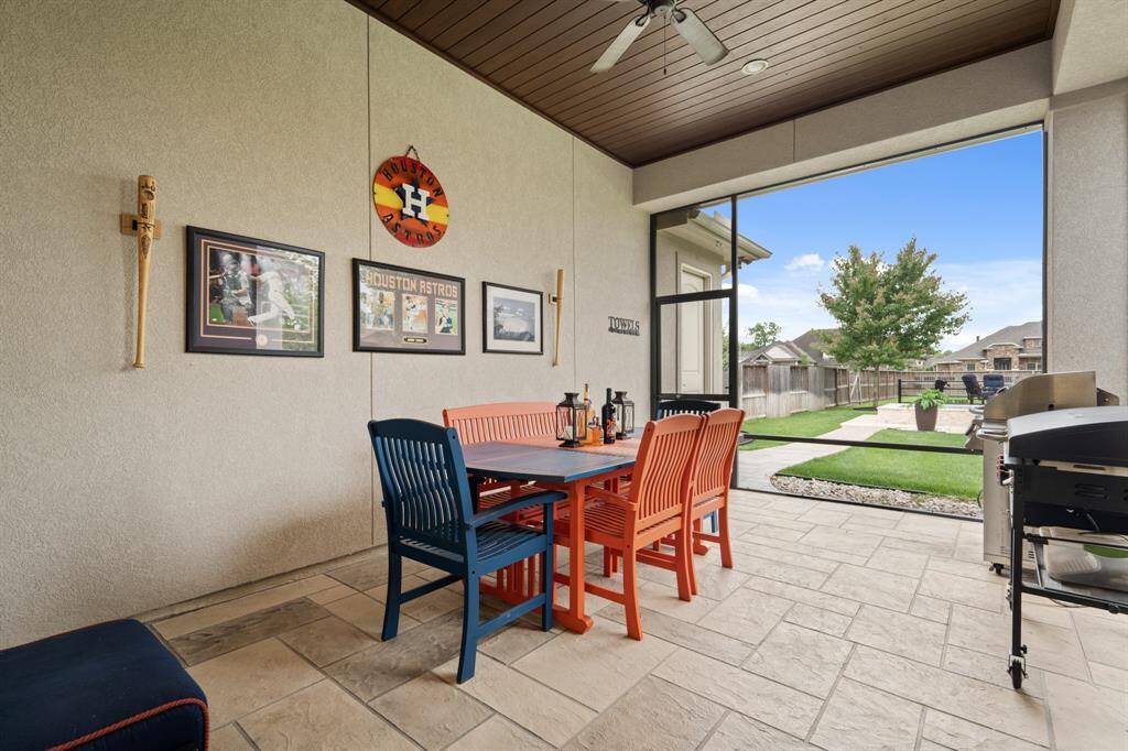 This Screened-In Porch is fixed with ceiling fans to help keep the air moving and comfortable. The door to the left after leaving the Patio leads to the Garage.