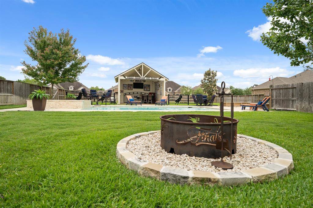 Pull up a chair and enjoy an evening under the stars surrounding this custom fire pit.