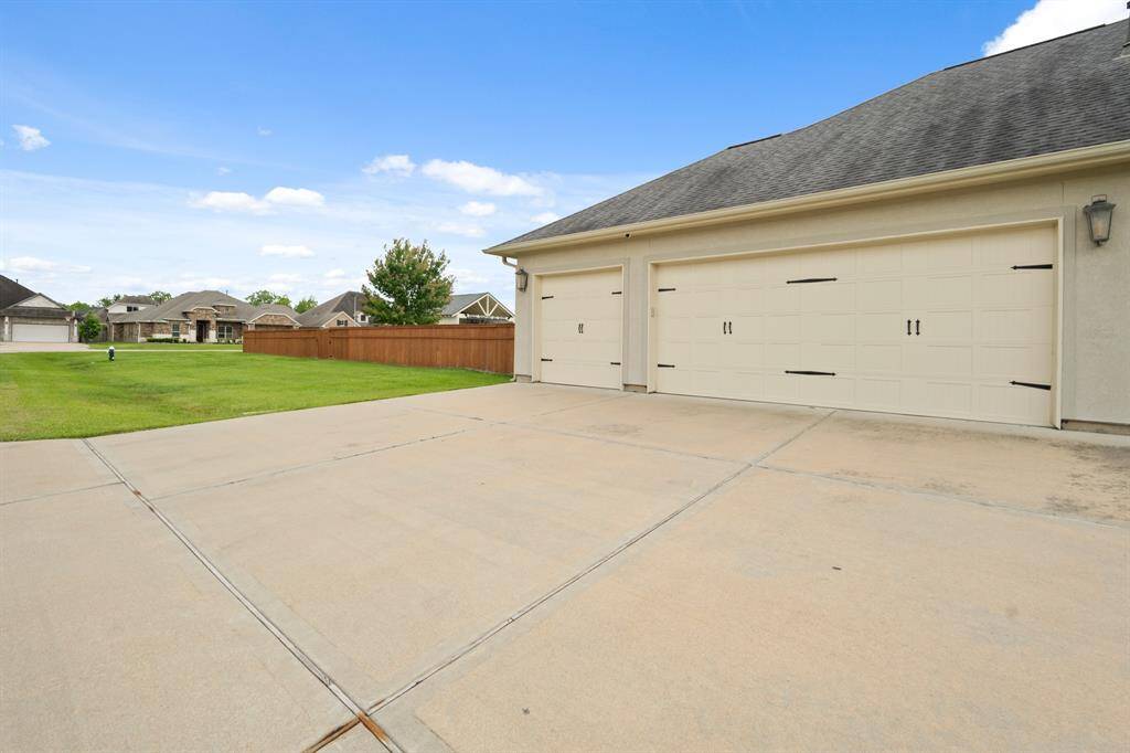 The oversized, 3-car Garage is positioned to the side of the home so as not to interfere with the impressive front façade. The Garages are equipped with a mini split that both heats and cools. Tinkering around in the Garage just got a whole lot more comfortable!