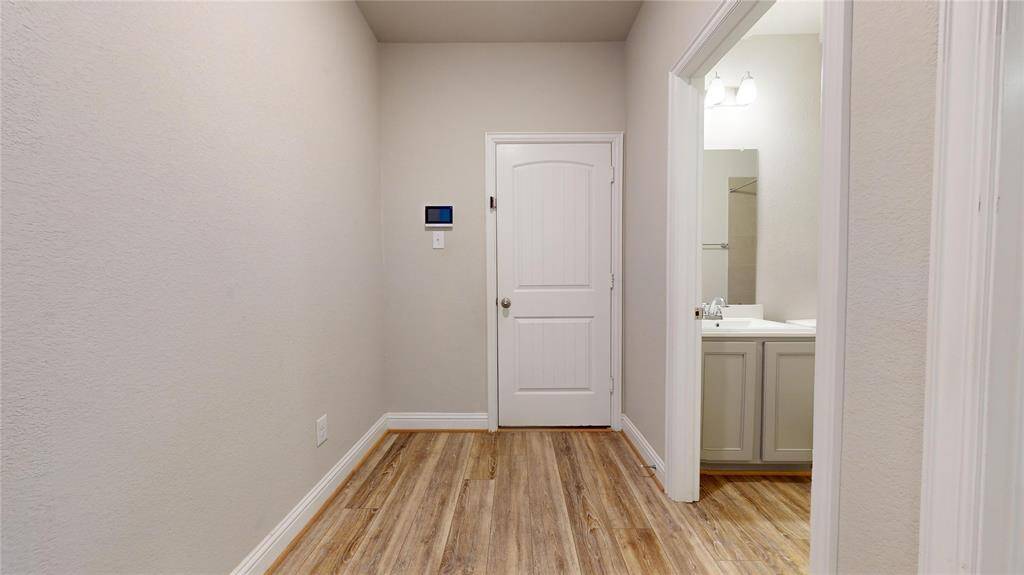 This inviting mud area offers a practical space for organizing shoes and coats, keeping your home tidy and welcoming.