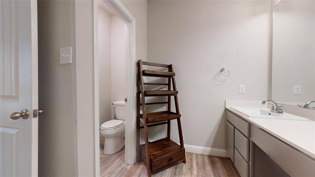 Spacious primary bathroom featuring a sleek, modern shower.