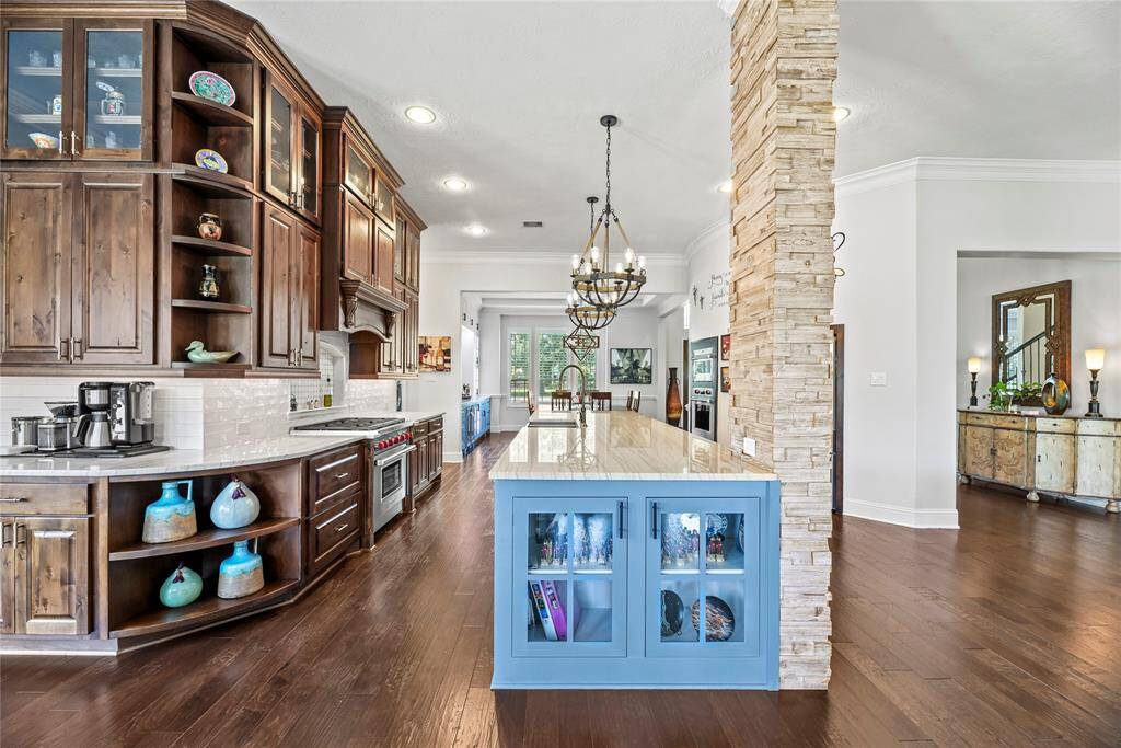 An abundance of meticulously designed cabinetry and expansive counter space offers both unparalleled storage and a sleek, functional work area, ensuring every culinary need is met with style and efficiency.