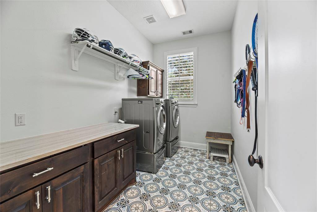 This well-appointed space includes ample storage and efficient organization, making laundry day a breeze while keeping your home tidy and functional.