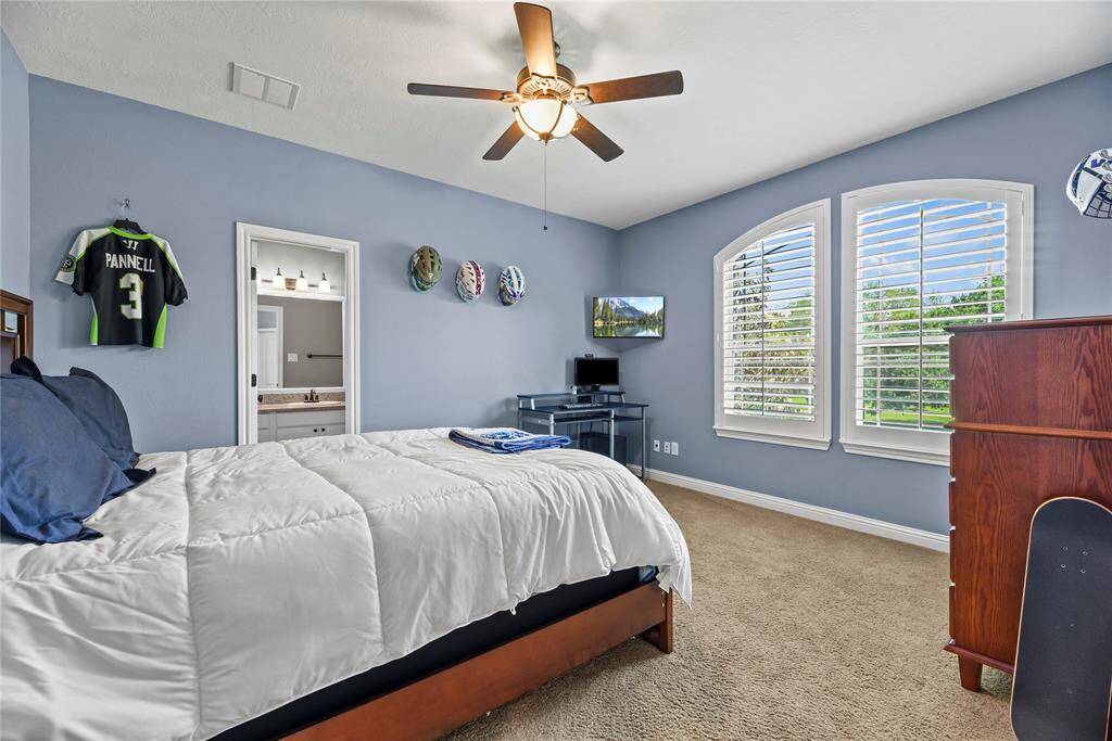 The fifth bedroom is generously proportioned, offering ample space and versatility, creating a comfortable and inviting retreat for relaxation or personalized use.