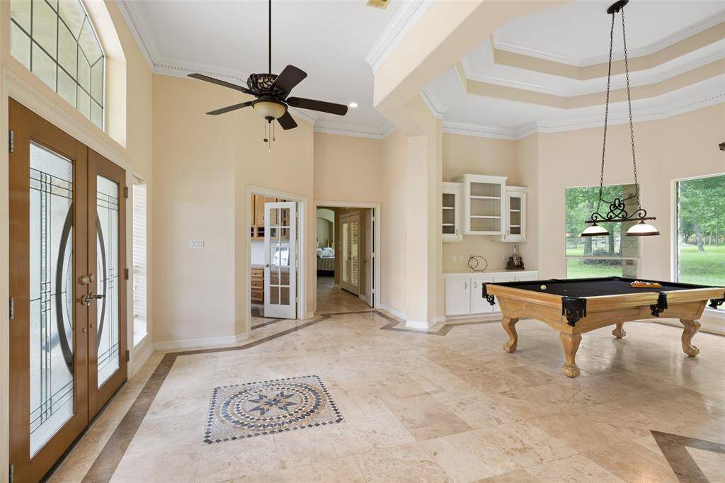A view looking towards the foyer and the formal living or game room.