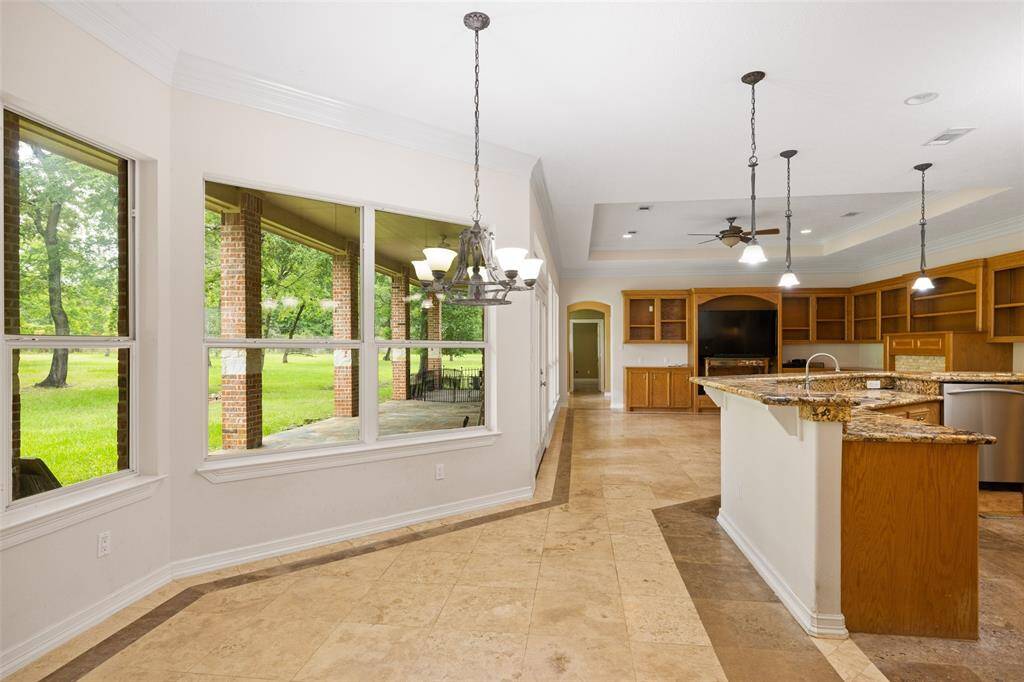 View of the breakfast area that is surrounded by the wall of windows.