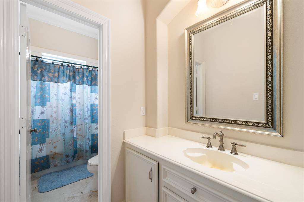 The private bath to one of the secondary bedrooms.