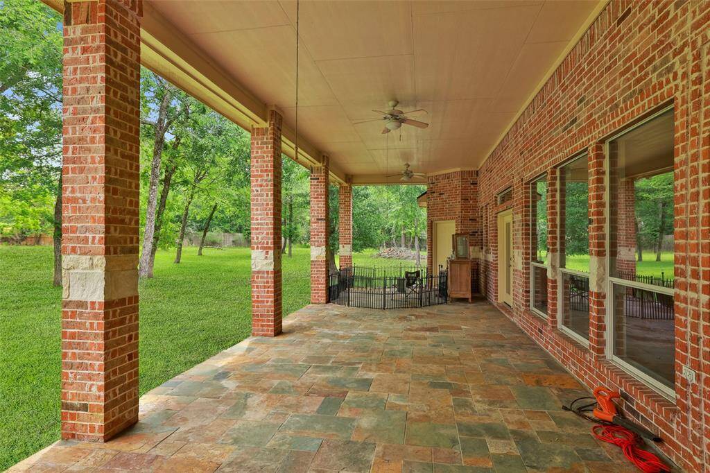 A view of the spacious covered patio. Ready for your outdoor furniture.