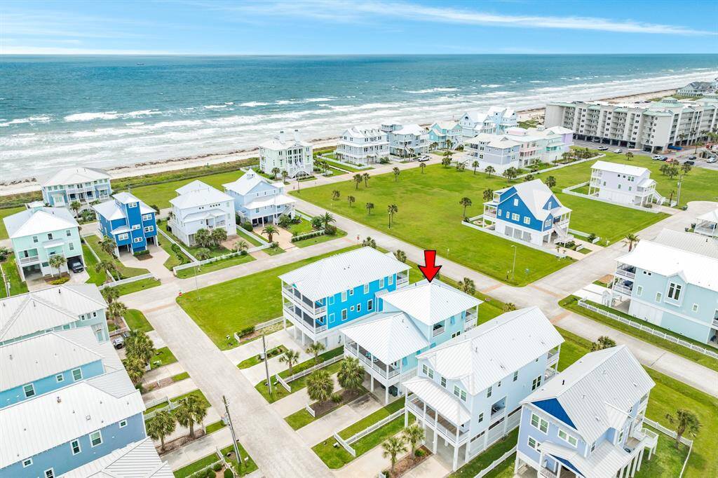Charming coastal home with a striking blue exterior, located in a picturesque Beachside Village neighborhood. Enjoy ocean views and a short walk to the beach. Ideal for those seeking a serene beach lifestyle.