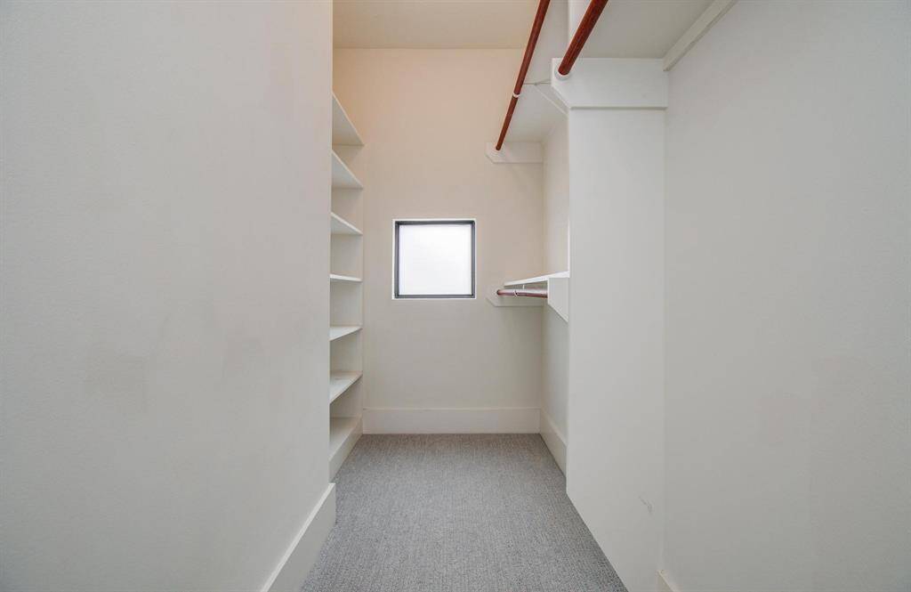Large walk in Master Closet with natural lighting.