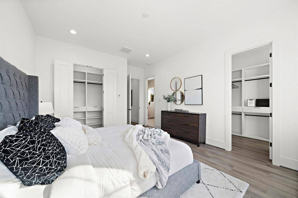 Take a peek into the two spacious closets, thoughtfully designed with custom shelving and soft-close cabinets, providing plenty of room for all your storage needs.