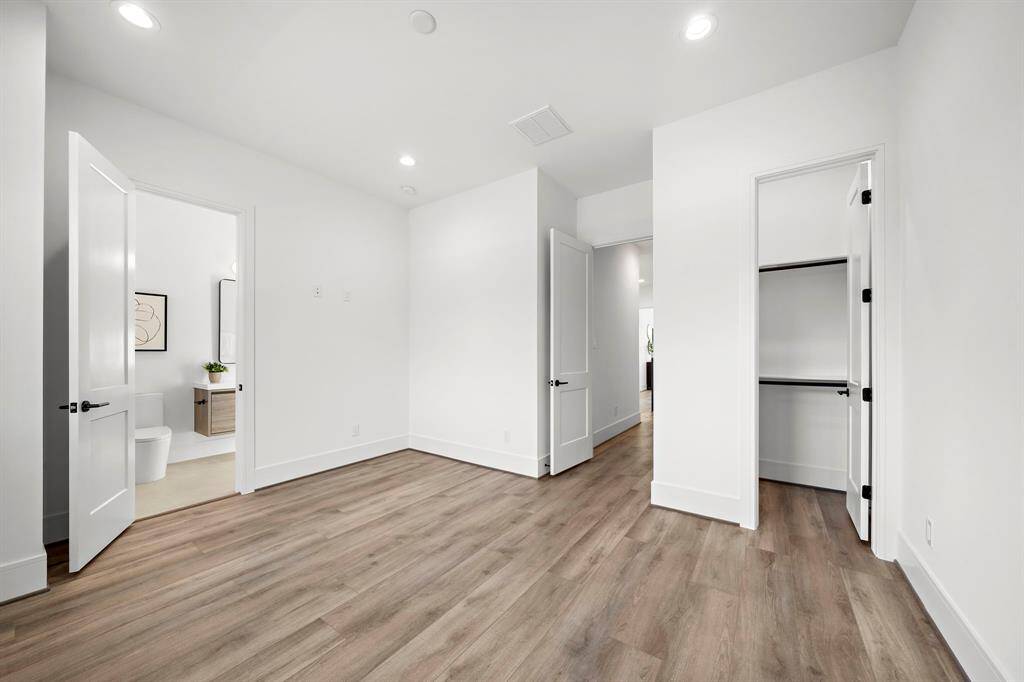 Both guest bedrooms are thoughtfully designed with spacious walk-in closets, providing ample storage and organization options.