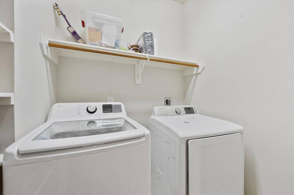 Laundry room is right next to a linen closet.