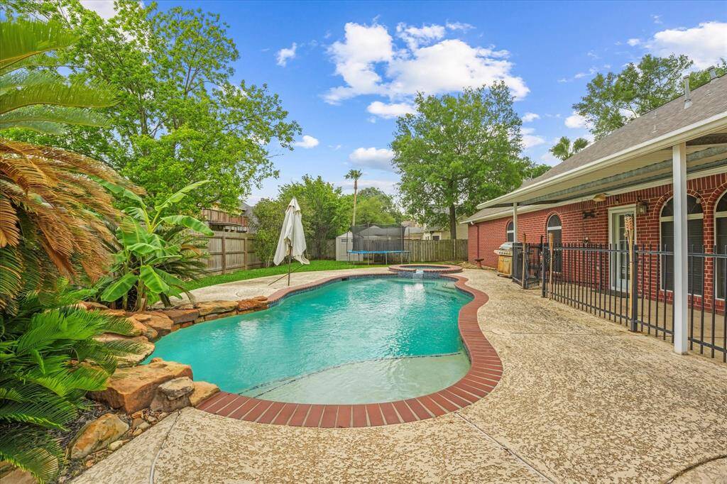 Your new pool is perfect for Texas summers and has a cool rock water feature!