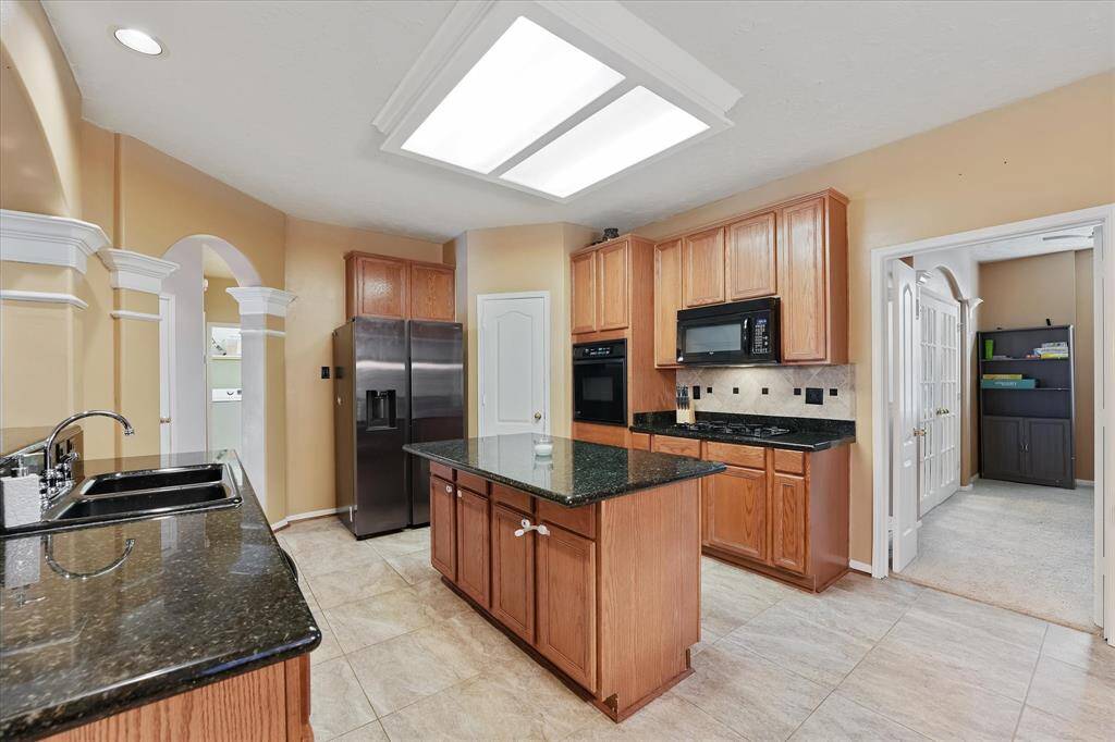 This kitchen has plenty of counter and storage space.