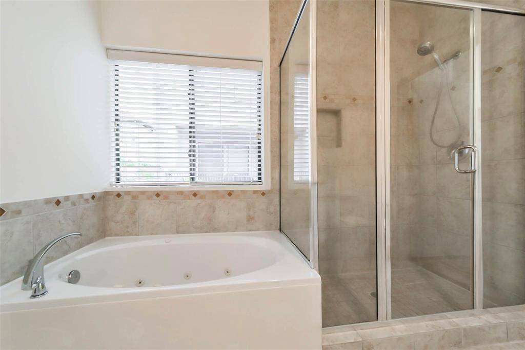 Luxurious jetted tub and separate shower