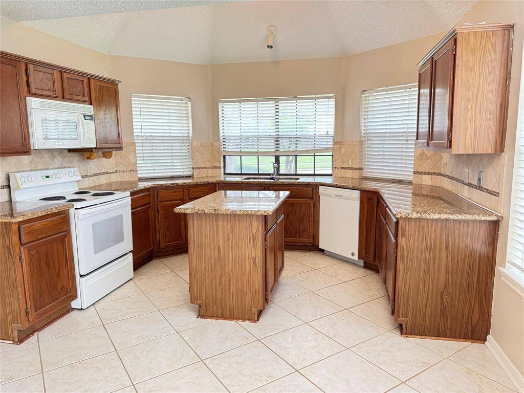 Spacious kitchen with island and lots of storage space.