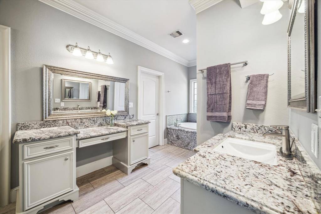 LARGE WALK-IN CLOSET IS ACCESSIBLE VIA THE PRIMARY BATHROOM