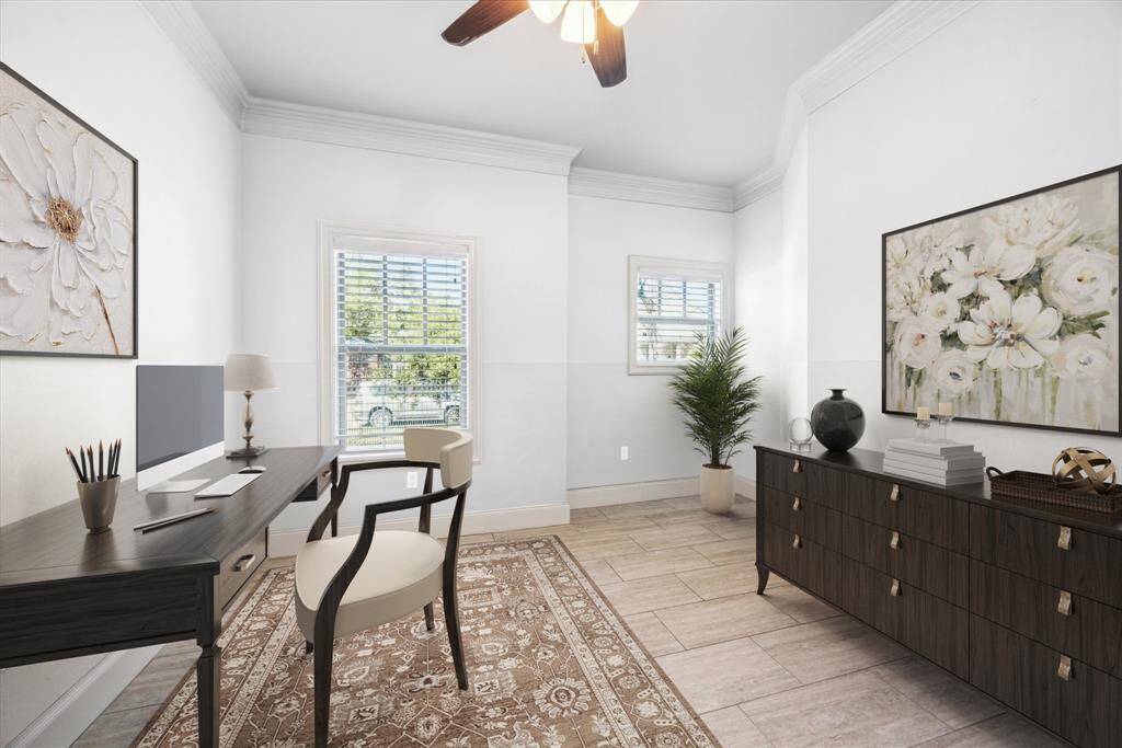 FLEX ROOM IS LOCATED OFF OF THE PRIMARY AND IS SEEN HERE VIRTUALLY STAGED AS AN OFFICE. FEATURES GREAT VIEWS OF THE FRONT YARD.