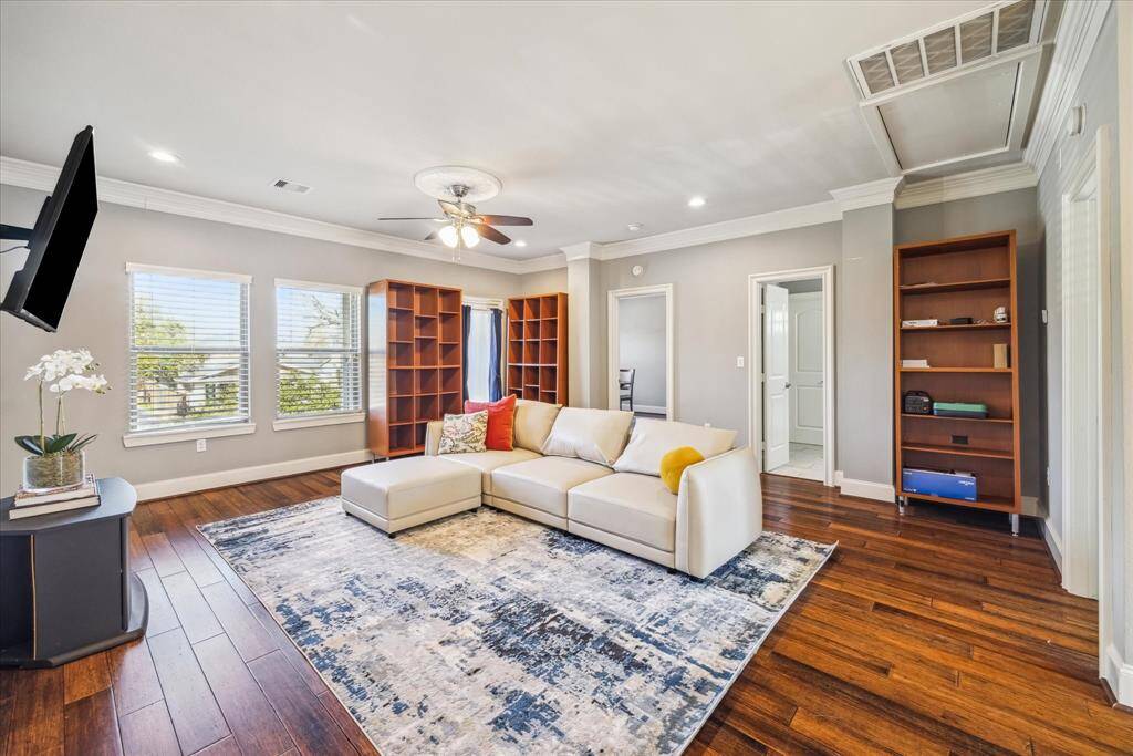 SECOND FLOOR GAME ROOM WITH ACCESS TO FRONT BALCONY, TWO SECONDARY BEDROOMS AND AN ATTIC SPACE THAT COULD BE BUILT OUT FOR ADDITIONAL SQUARE FOOTAGE.