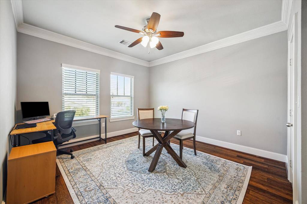 ONE OF THE SECONDARY BEDROOMS, CURRENTLY SET UP AS AN OFFICE.
