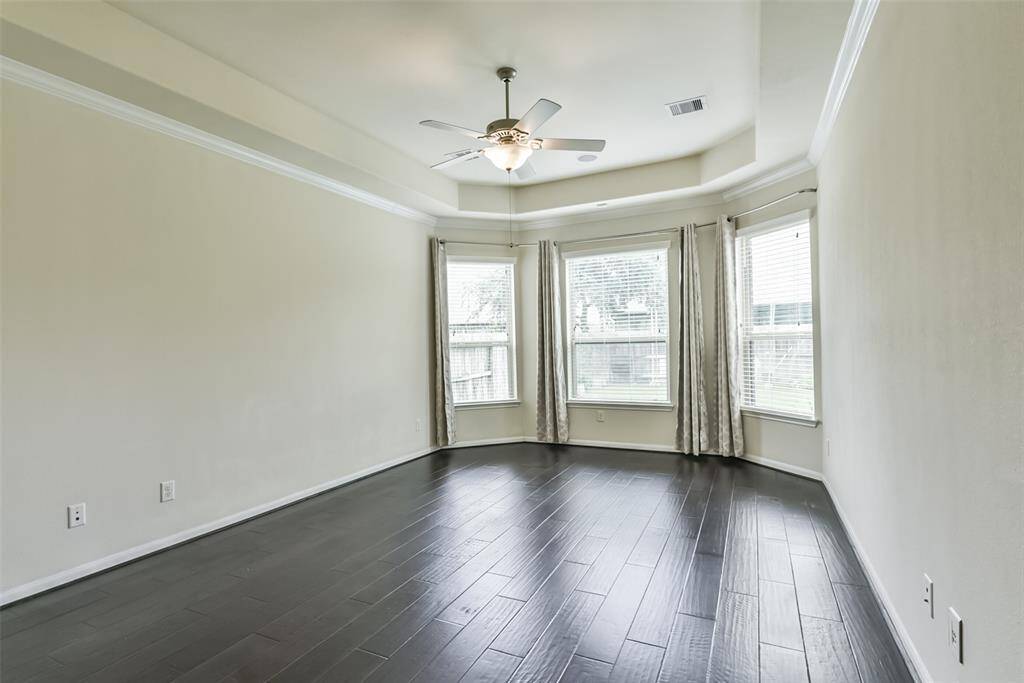 Step into the sanctuary of theprimary bedroom. Beautiful floors underfoot add a touch of luxury,creating a warm and invitingatmosphere that extends throughoutthe space.