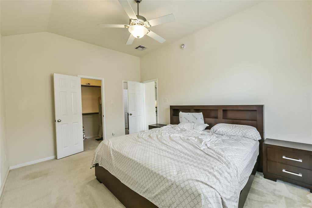 Third bedroom features awindow and plush carpet.
