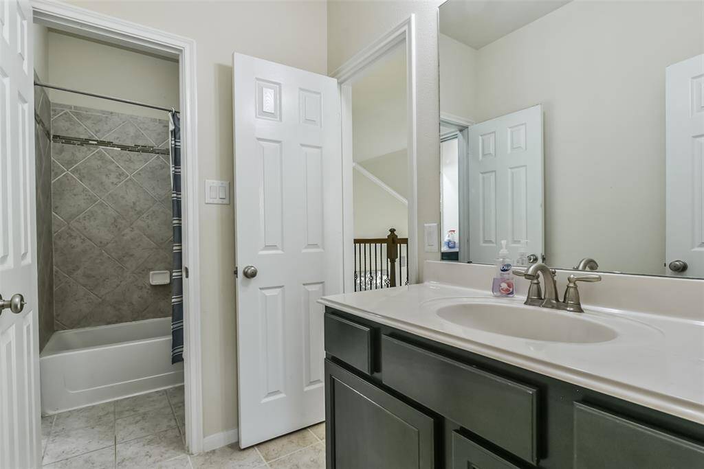Third bathroom features atub/shower combo and long vanitywith plenty of counter space.