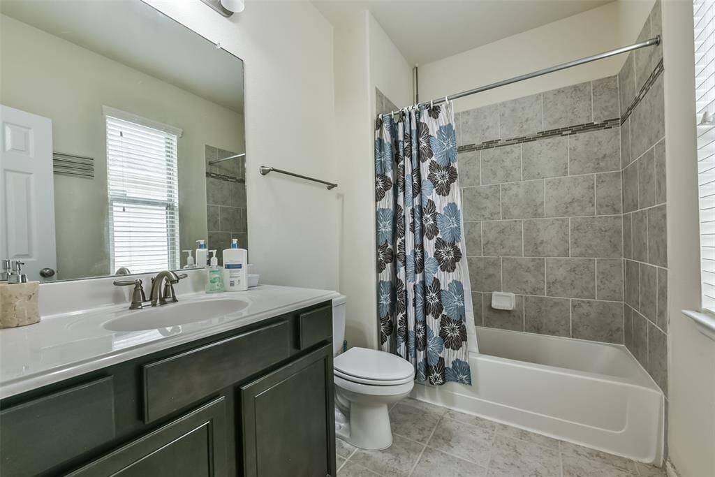 Secondary bathroom features atub/shower combo and long vanitywith plenty of counter space.