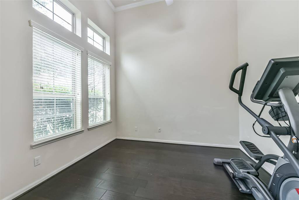 Transform your work routine into ahaven of productivity and comfort inthis thoughtfully designed homeoffice currently used as a home gym.