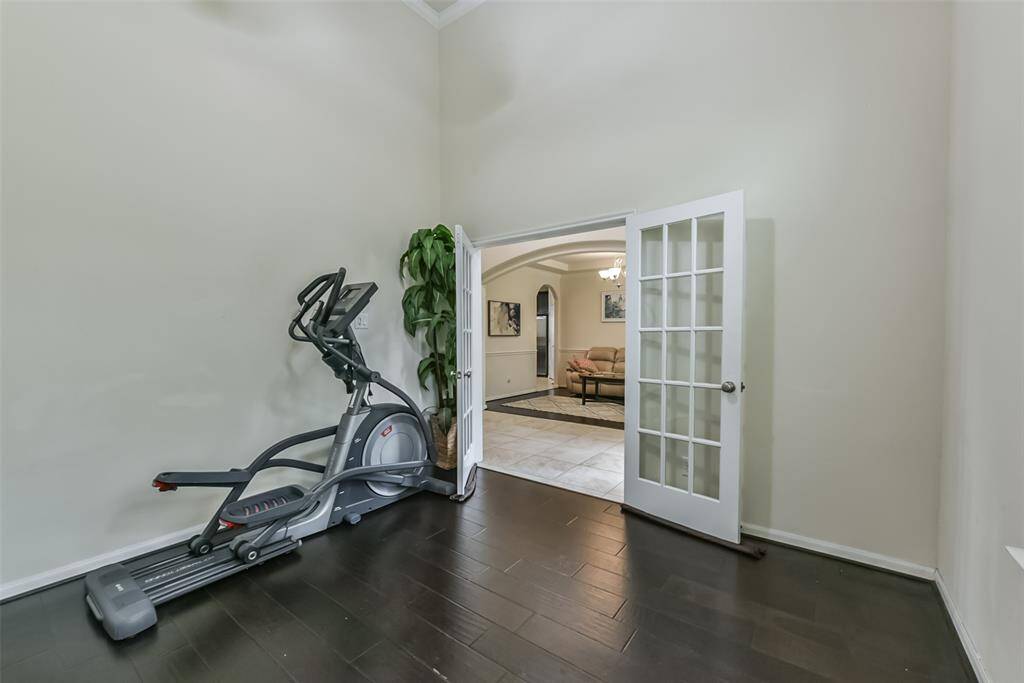 Located behind private Frenchdoors, the room features beautiful floors and windows that allow innatural light.