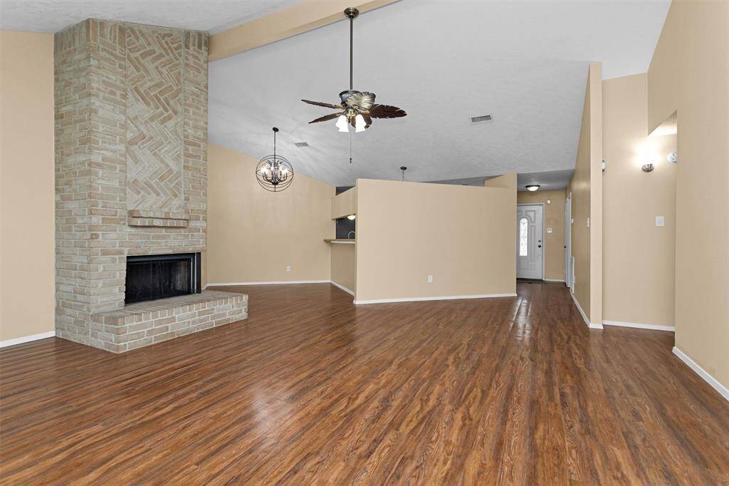 Looking back across family room you can see the formal dining room as well as the updated light fixture.