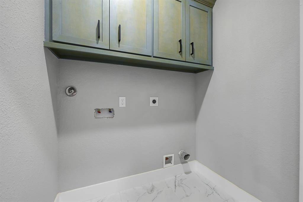 This home has electrical and gas connection for a dryer, so you can choose the kind that you prefer. There’s extra cabinet space in the laundry room, so you have plenty of room to store household necessities.
