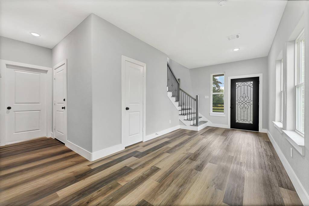 Waterproof click lock luxury vinyl plank flooring on first and second floor