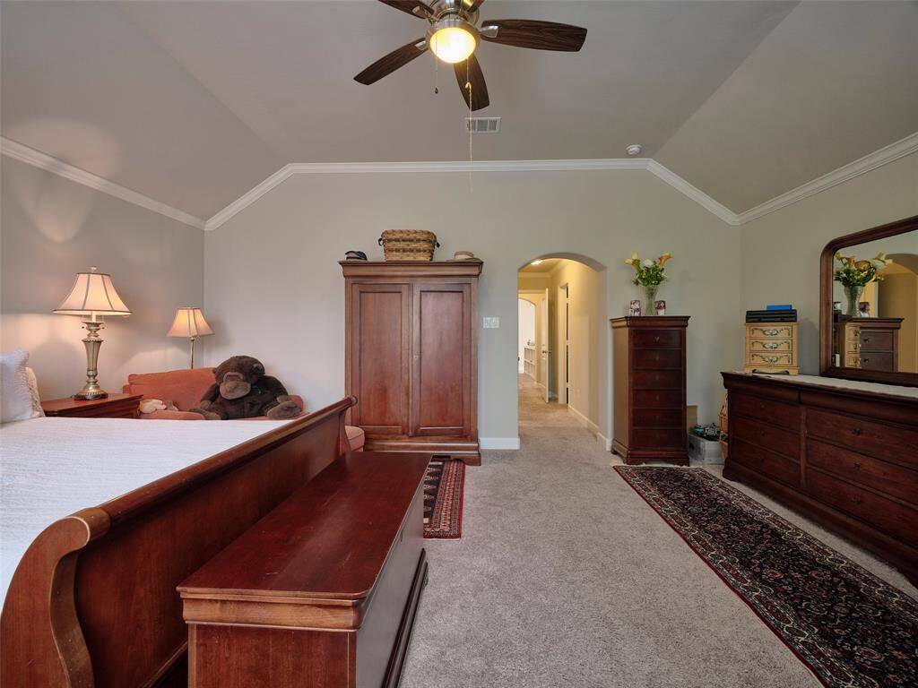 Large primary bedroom with a coffered ceiling The spacious primary bedroom features a coffered ceiling.