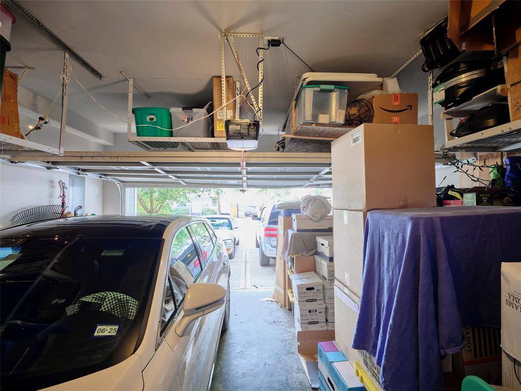 The high ceilings provide additional storage space above the garage door.