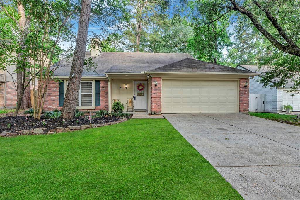 Great curb appeal with neat landscaping and a welcoming front entrance.