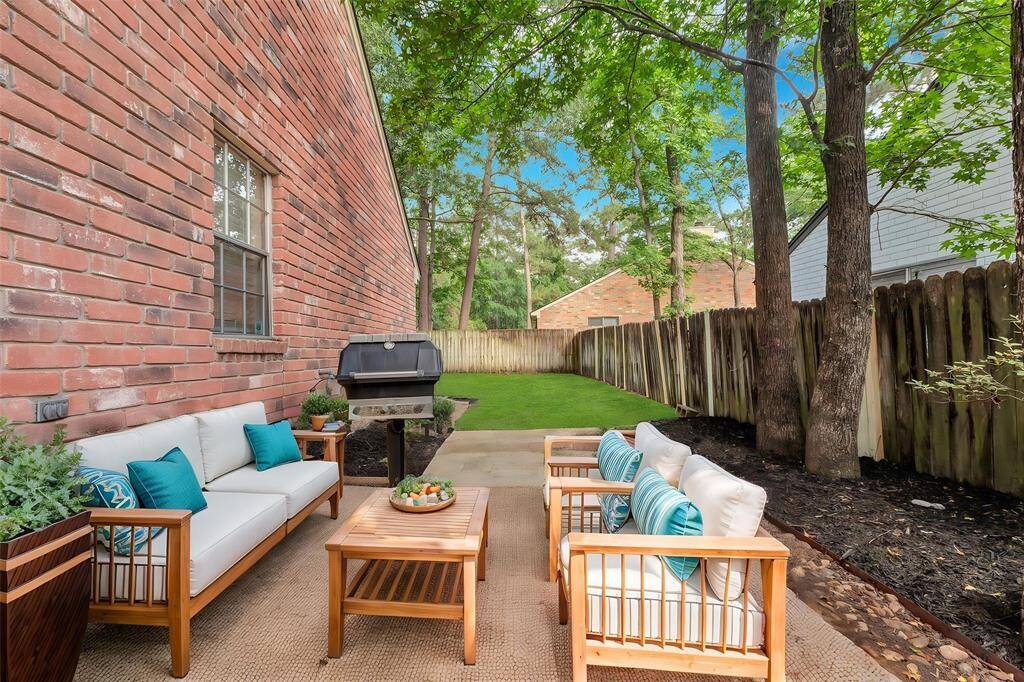 Virtually staged patio accessible from the breakfast area, perfect for outdoor dining and relaxation.